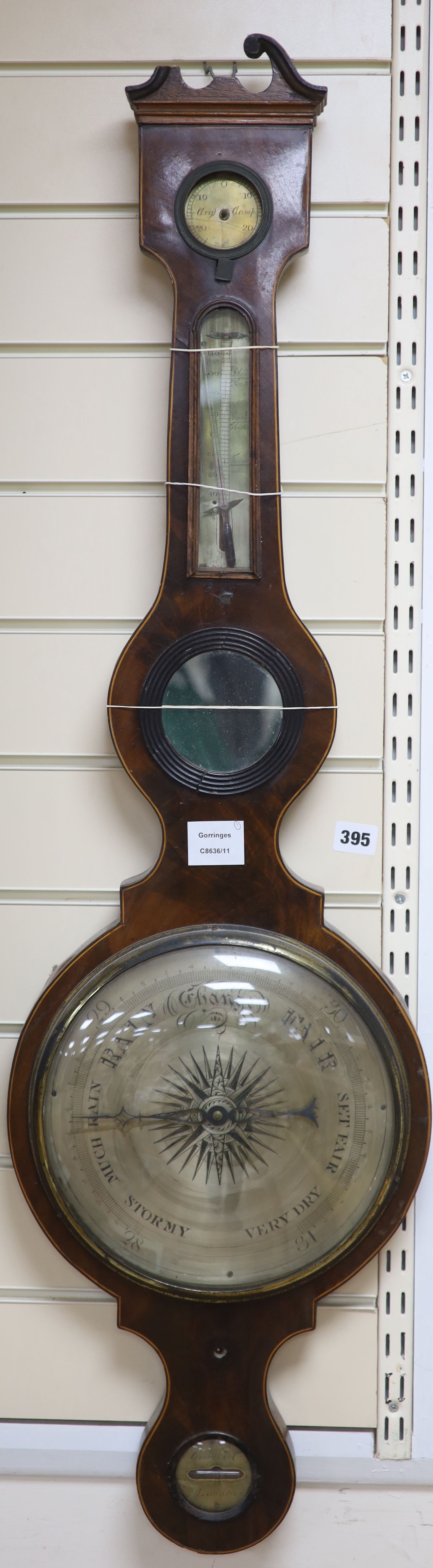 Ciceri and Co., London. A Regency inlaid mahogany wheel barometer and thermometer, length 119cm